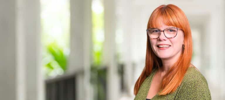 Head and shoulders photo of Catherine Gair on a blurred background - outsourced support in Weymouth